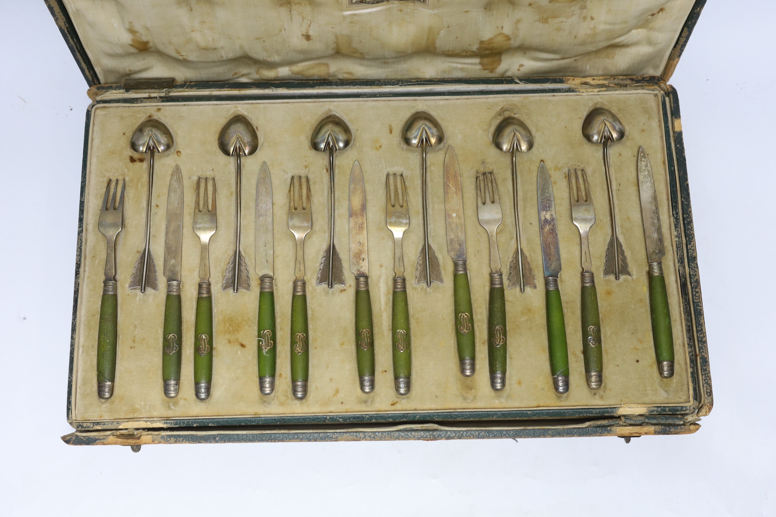 A cased French thirty six piece dessert set, comprising twelve white metal spoons and twelve pairs of phenolic handled white metal dessert eaters, all by Robert Linzeler, knife 15.5cm.